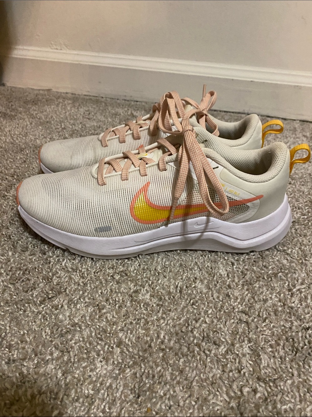 Nike Women's Light Cream Running Shoes with Yellow Swoosh and Peach Accents